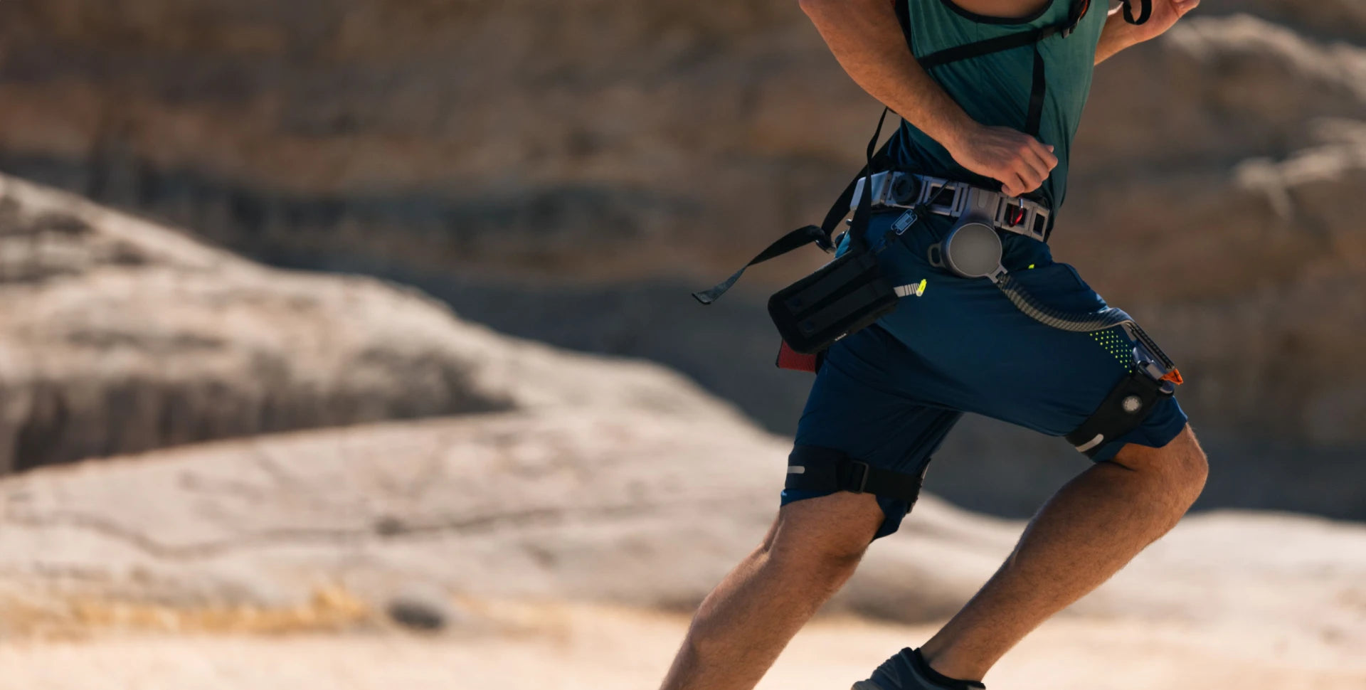 Man wearing Ascentiz exoskeleton hip assist runing fast on trails