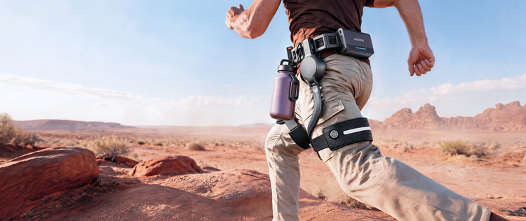 Ascentiz hip exoskeleton during a forward stride in a desert setting.