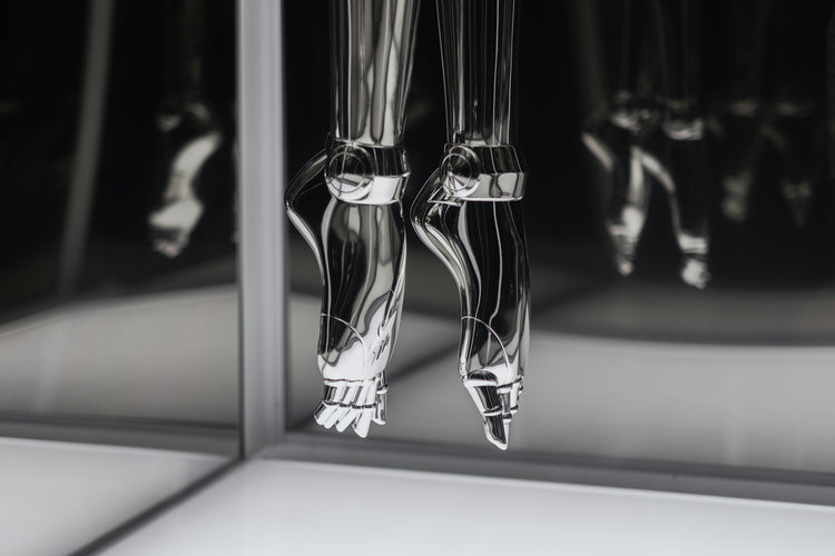 Powered prosthetic leg and wearable hip exoskeleton shown side by side.