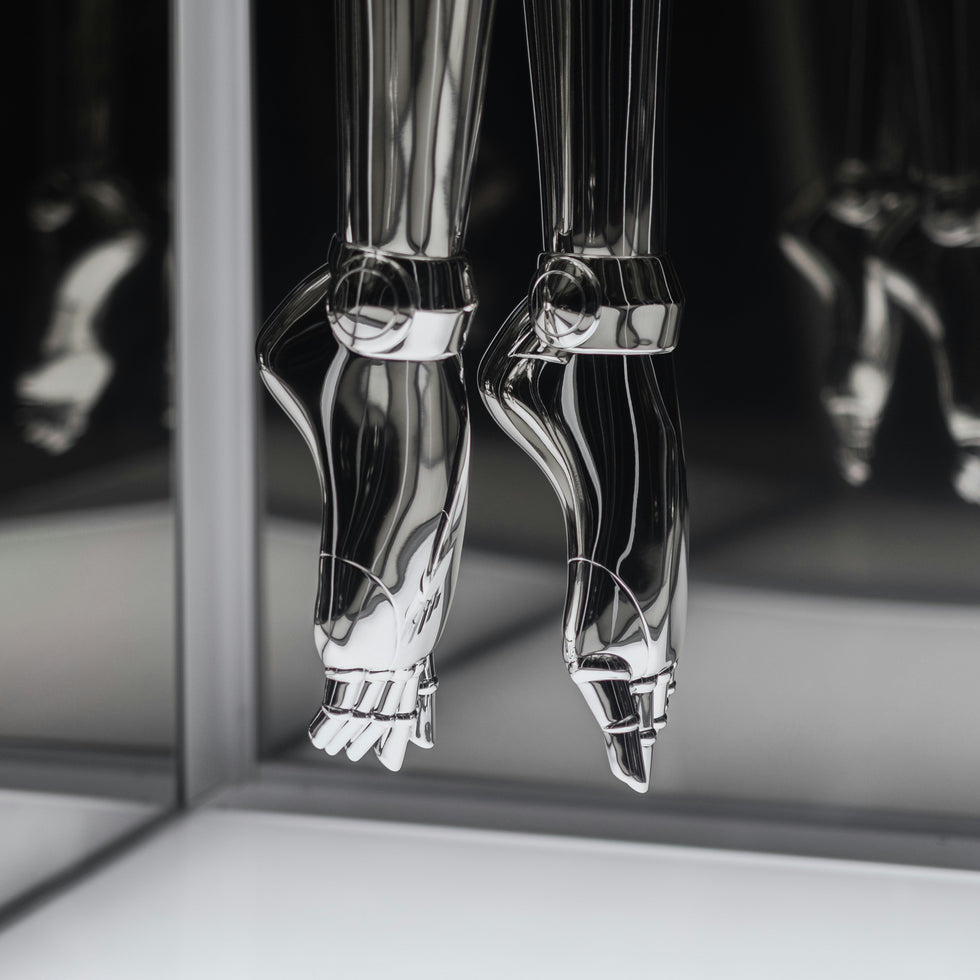 Powered prosthetic leg and wearable hip exoskeleton shown side by side.