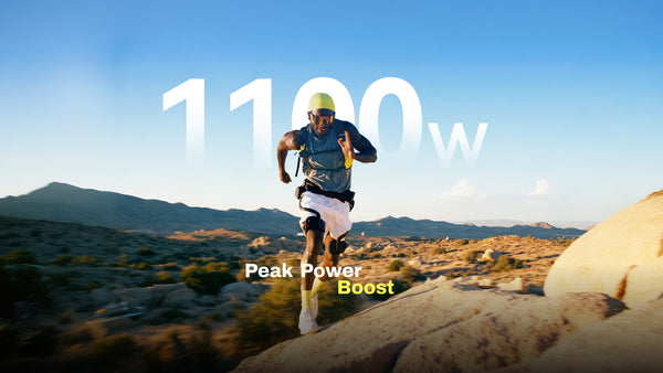 A trail runner jumping over rocks with an Ascentiz H Ultra exoskeleton featuring 1100W peak power boost.