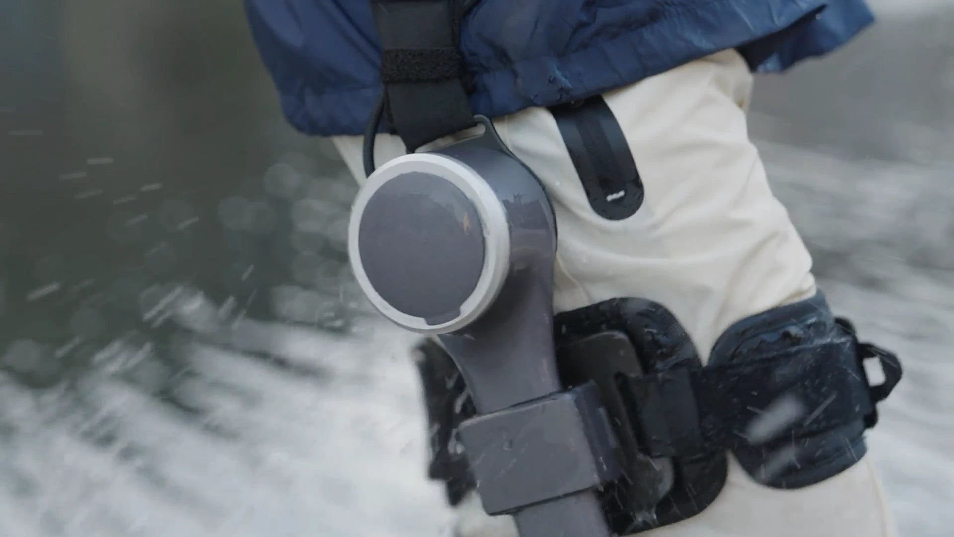 Man wearing Ascentiz exoskeleton performing waterproofing test