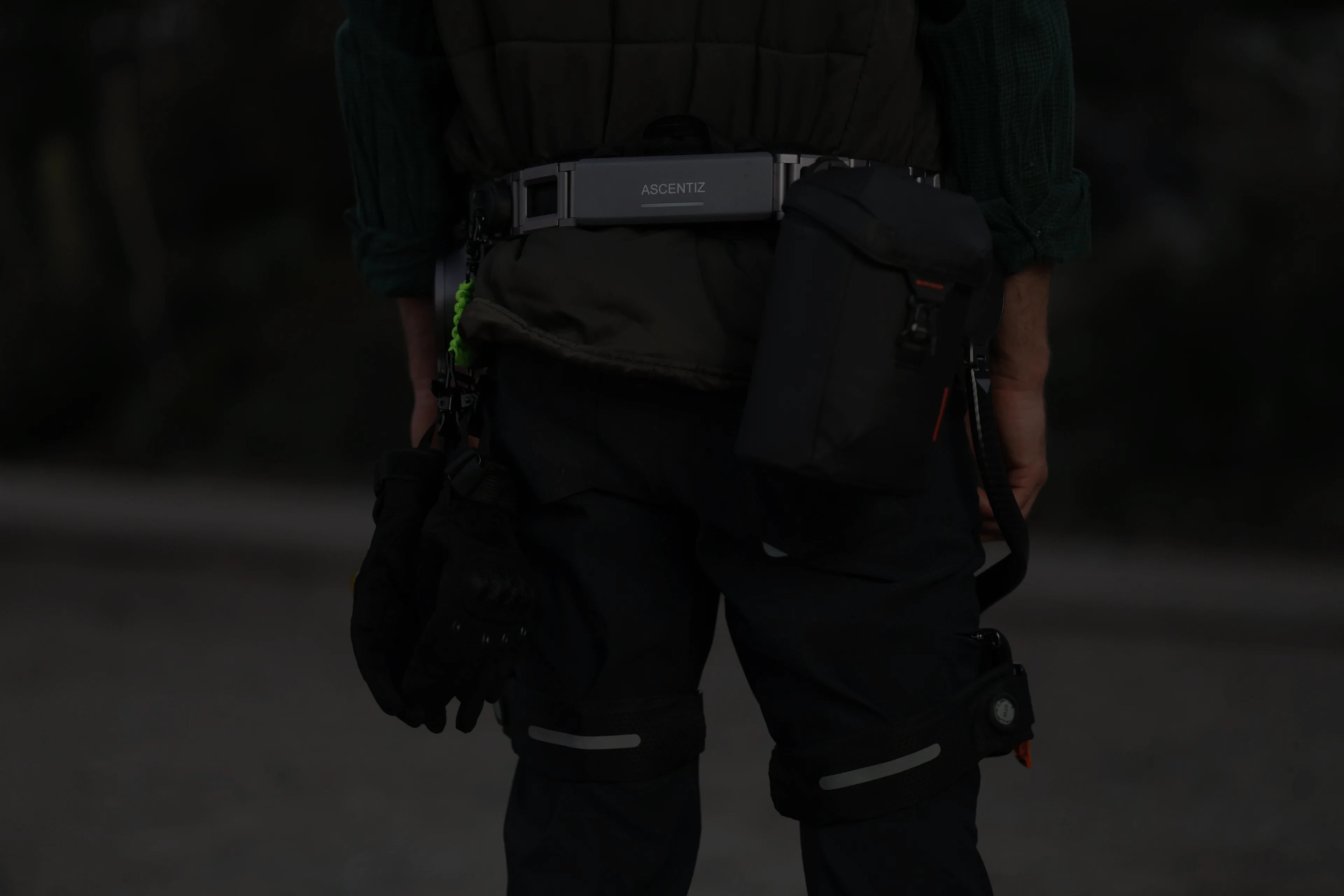 Man wearing Ascentiz Hip exoskeleton, back view