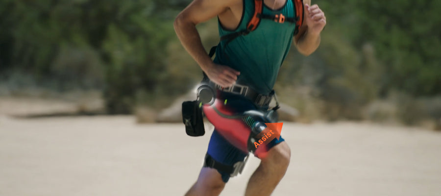 A man running in a desert wearing the Ascentiz hip exoskeleton.