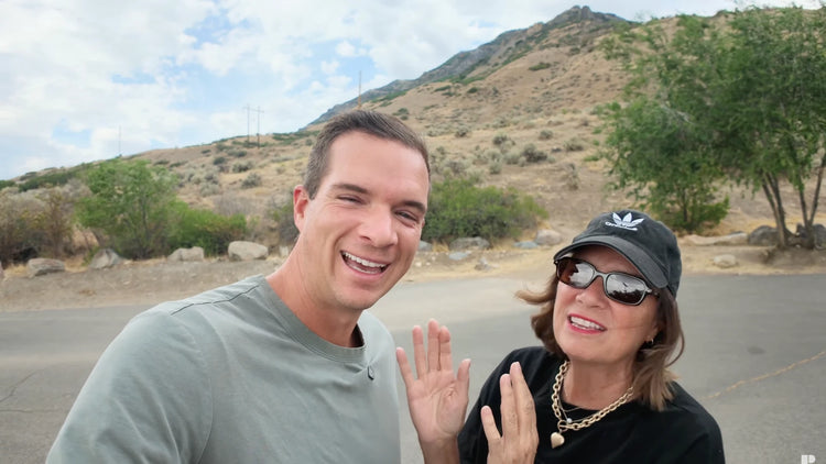 Jared and his mother smiling outdoors before testing the Ascentiz exoskeleton on a trail.