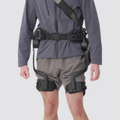 A close-up product appearance showcase of the Ascentiz modular hip exoskeleton, highlighting its sleek black technical design, premium carbon-fiber finish, and futuristic industrial aesthetic over athletic wear.