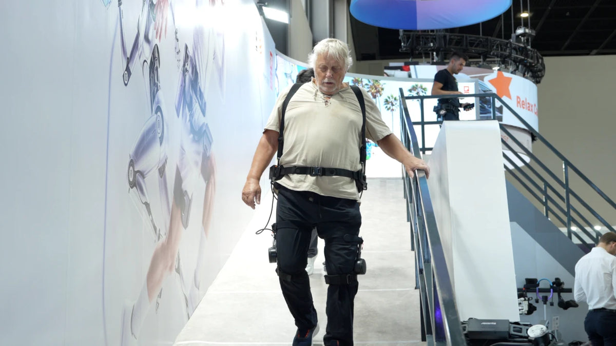 A visitor wearing an exoskeleton on the demonstration ramp.
