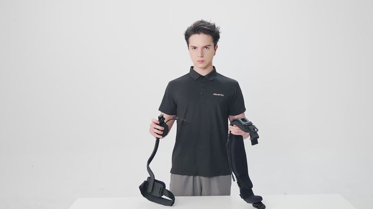 Studio shot of a model demonstrating the module assembly process for the Ascentiz exoskeleton system, holding the central chassis and hardware components against a white background.